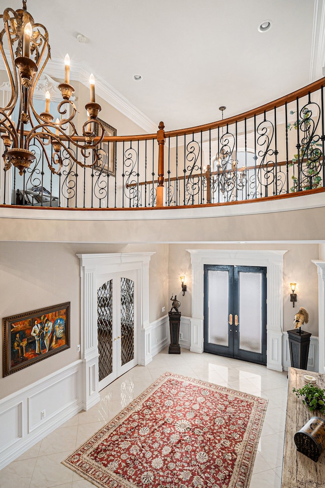 living room with french doors and a chandelier