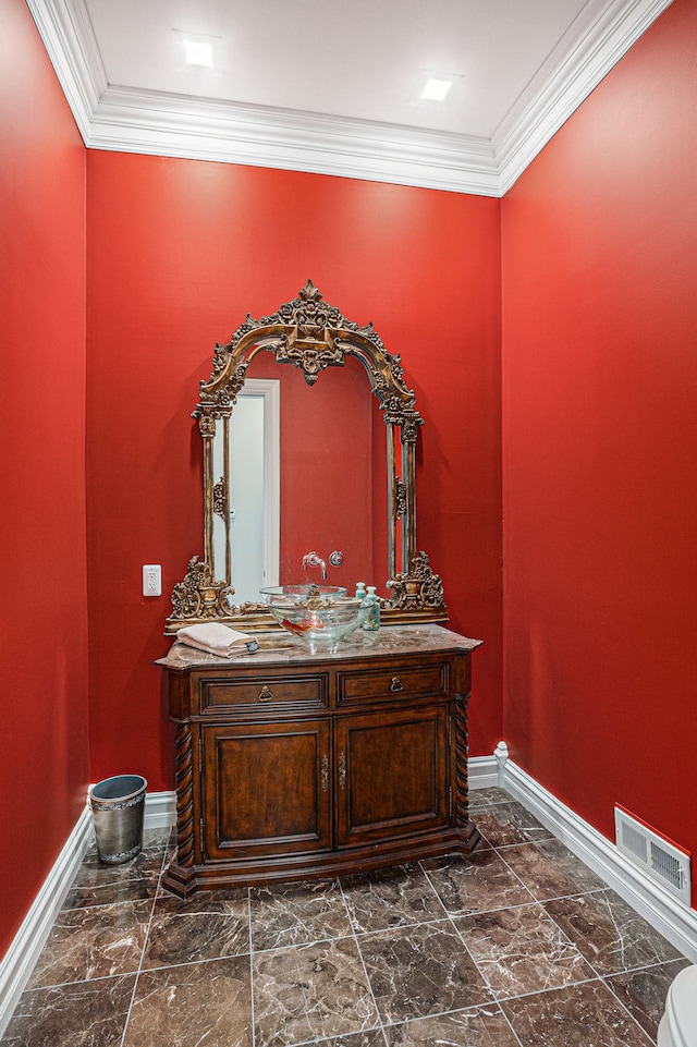 bathroom with visible vents, marble finish floor, ornamental molding, baseboards, and vanity