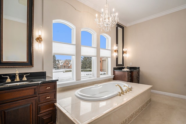 bathroom with baseboards, two vanities, ornamental molding, a sink, and a garden tub