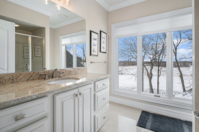 bathroom with tile patterned flooring, vanity, a shower with door, and ornamental molding