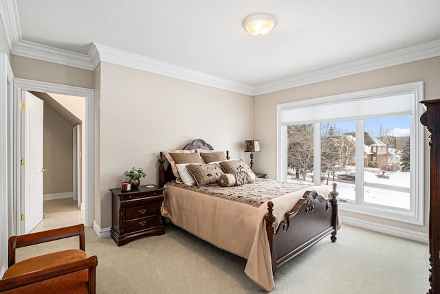 bedroom featuring baseboards, light carpet, and crown molding