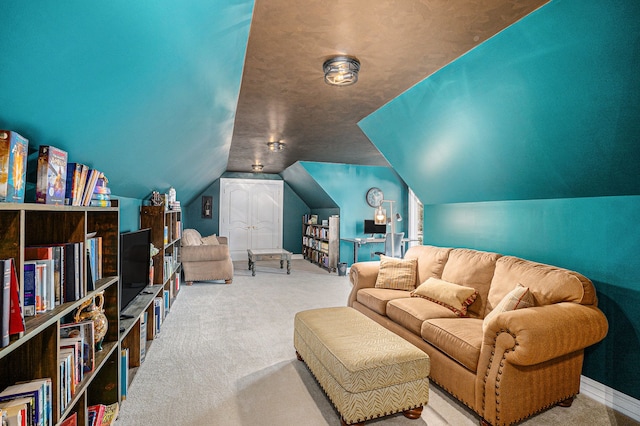 carpeted living room featuring baseboards and vaulted ceiling