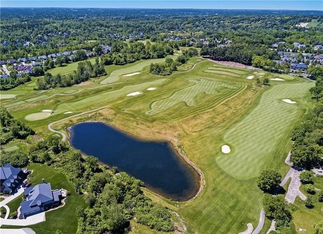 birds eye view of property featuring golf course view and a water view