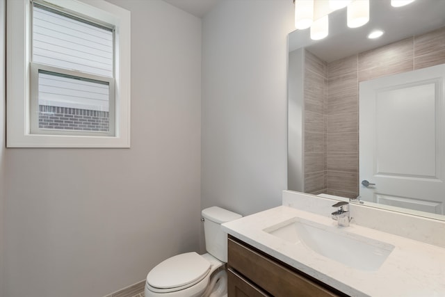 bathroom featuring vanity and toilet