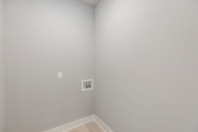 laundry room featuring hookup for a washing machine and hardwood / wood-style flooring