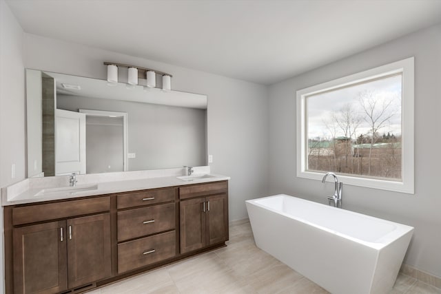 bathroom with vanity and a tub to relax in