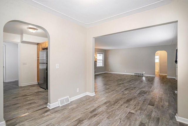 spare room with dark wood-type flooring