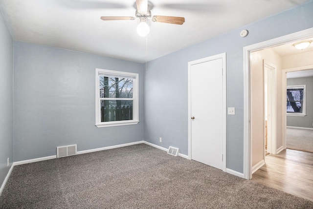 unfurnished room featuring carpet flooring and ceiling fan