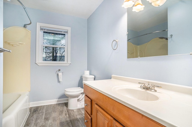 full bathroom featuring hardwood / wood-style floors, vanity, shower / bathtub combination, and toilet