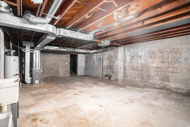 basement with gas water heater and heating unit