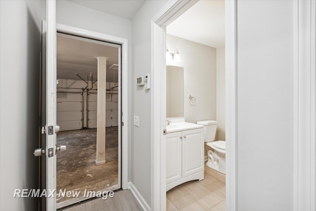 bathroom with vanity and toilet