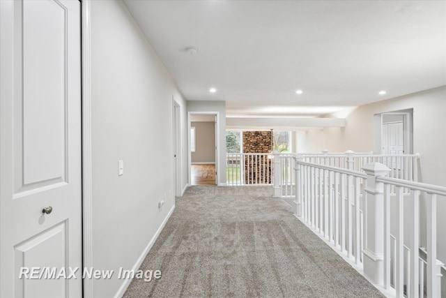 hallway featuring light carpet