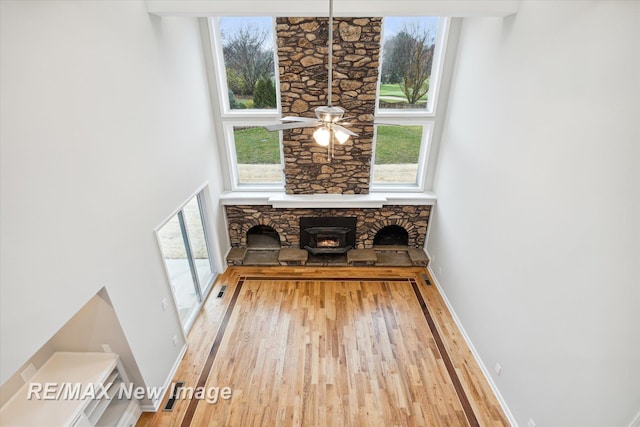 60 Golfview Dr, Saginaw, MI 48638 - unfurnished living room with wood finished floors, healthy amount of natural light, and baseboards