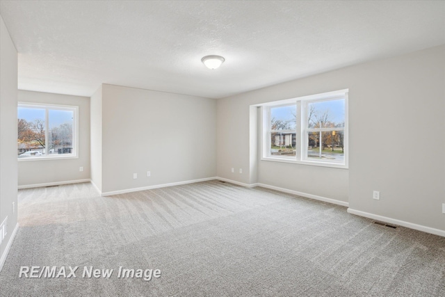 60 Golfview Dr, Saginaw, MI 48638 - spare room featuring carpet floors and baseboards
