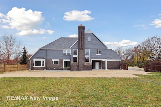 60 Golfview Dr, Saginaw, MI 48638 - back of house with a patio area and a chimney