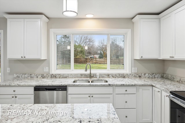 kitchen with white cabinetry, sink, and stainless steel appliances