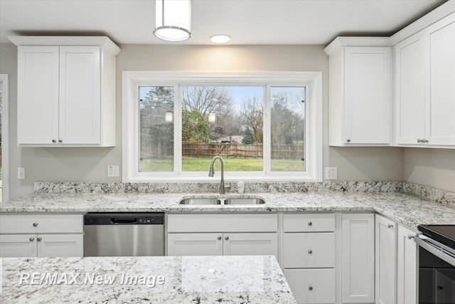 60 Golfview Dr, Saginaw, MI 48638 - kitchen featuring stainless steel appliances, a sink, and white cabinetry