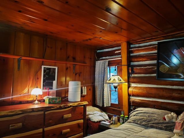 bedroom with wooden walls and wood ceiling