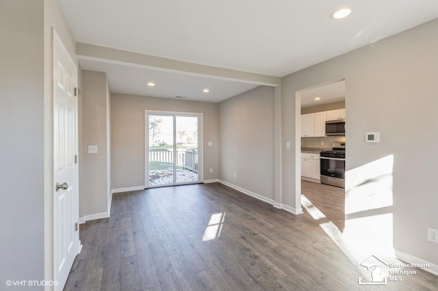 spare room featuring hardwood / wood-style flooring