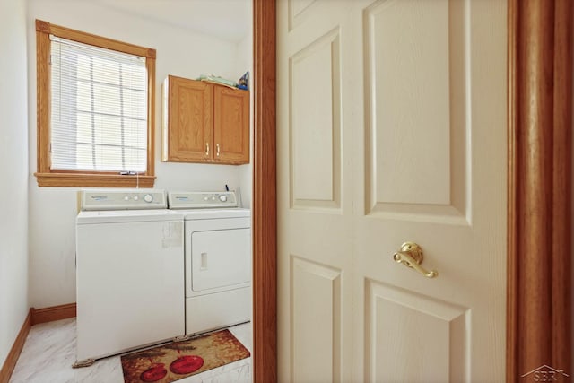 laundry room with cabinets and independent washer and dryer