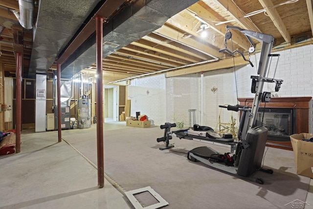 exercise room with gas water heater and heating unit