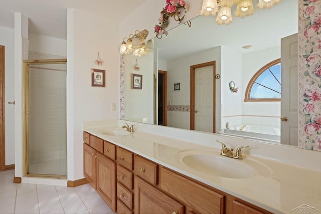 bathroom with tile patterned flooring, shower with separate bathtub, and vanity