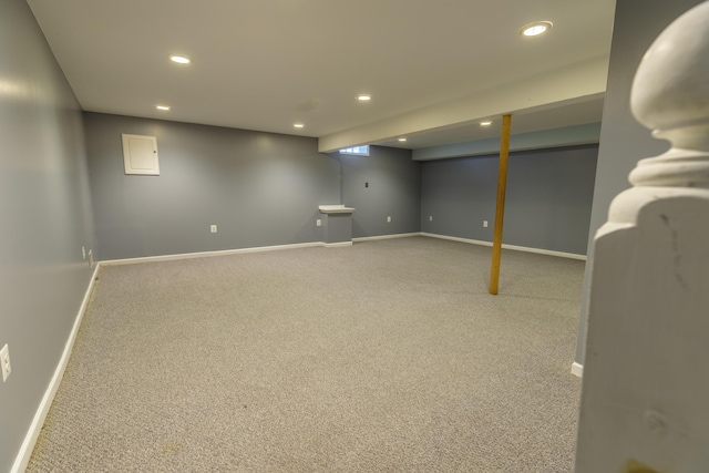 finished below grade area featuring carpet flooring, recessed lighting, and baseboards