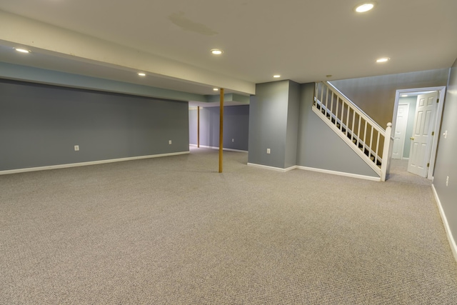 finished below grade area featuring recessed lighting, stairway, baseboards, and carpet floors