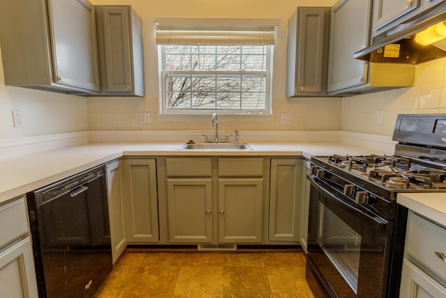 kitchen featuring visible vents, under cabinet range hood, decorative backsplash, black appliances, and a sink