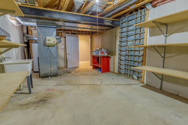 unfinished basement featuring heating unit and water heater