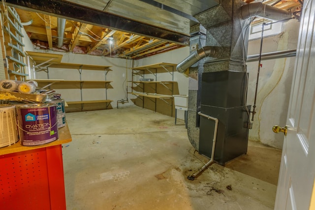 basement featuring heating unit