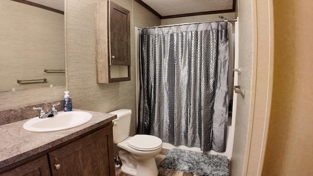 bathroom with a shower with shower curtain, ornamental molding, a textured ceiling, vanity, and toilet