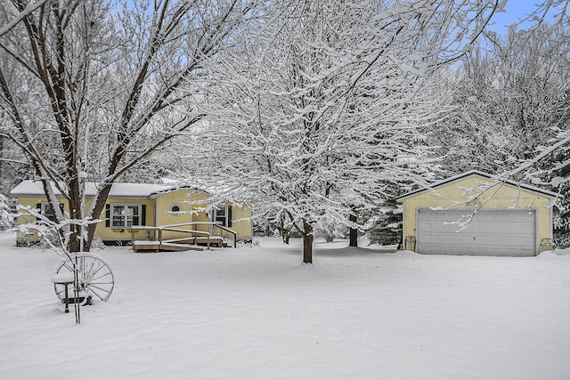 exterior space with a garage and a deck