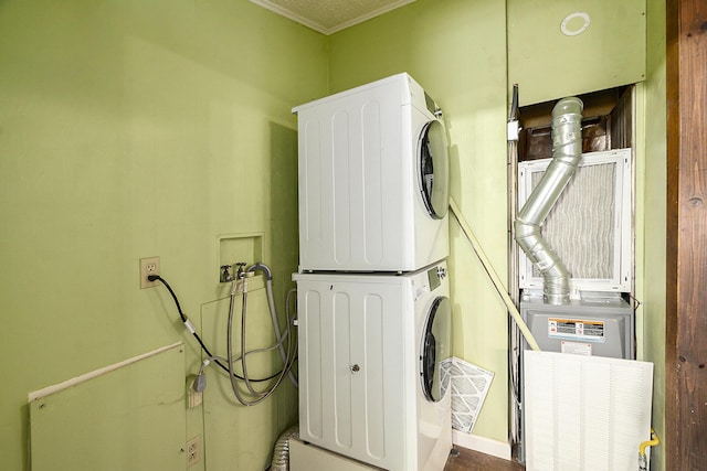 washroom featuring stacked washer and dryer