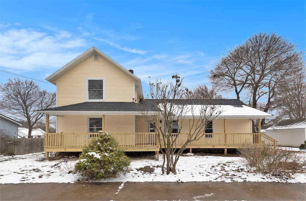 view of snow covered house