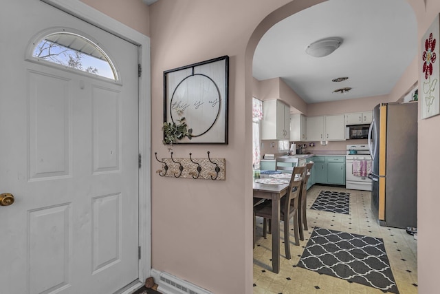 kitchen featuring white cabinets, stainless steel appliances, and sink