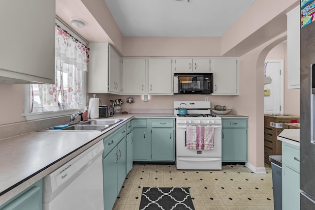 kitchen featuring white appliances and sink