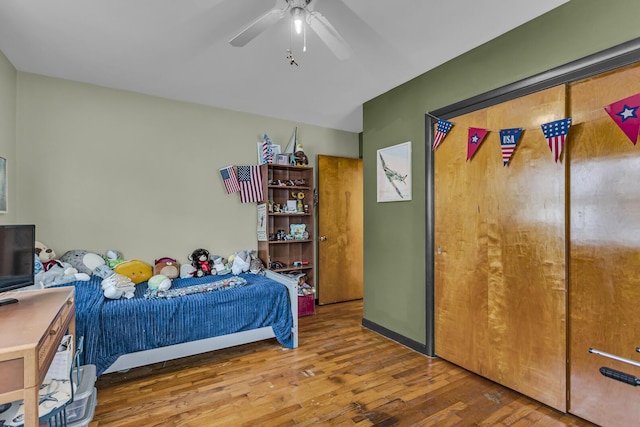 bedroom with hardwood / wood-style floors and ceiling fan