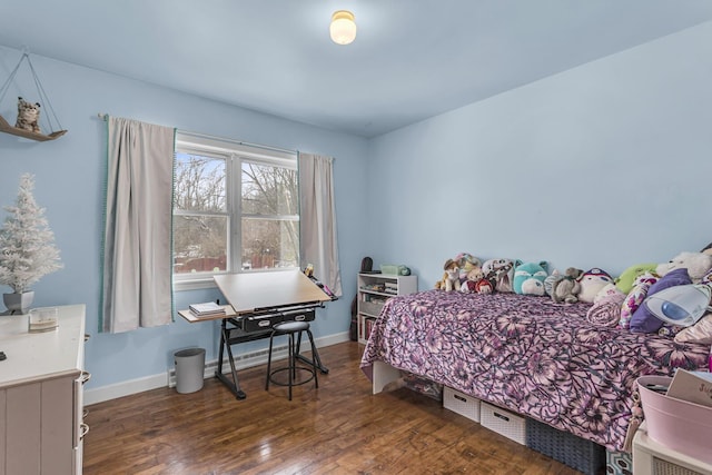 bedroom with dark wood-type flooring