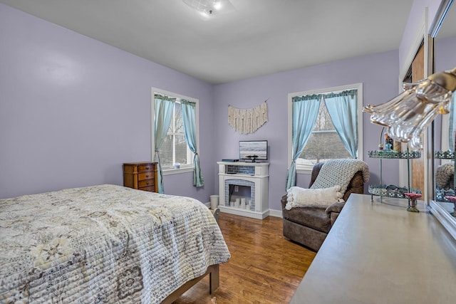 bedroom with dark wood-type flooring