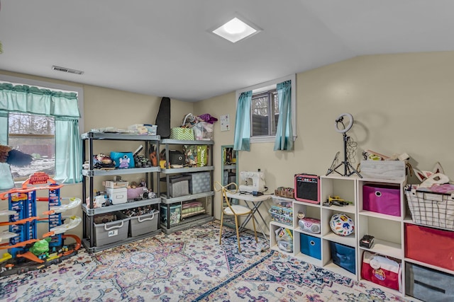 playroom featuring vaulted ceiling