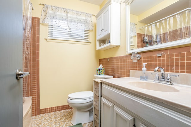 full bathroom featuring tile patterned floors, vanity, toilet, and shower / bathtub combination with curtain