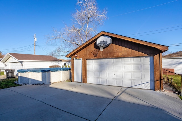 garage featuring a covered pool