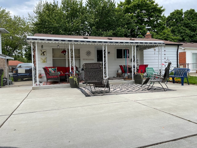 back of property with a porch