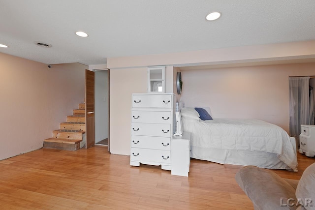 bedroom with light hardwood / wood-style floors