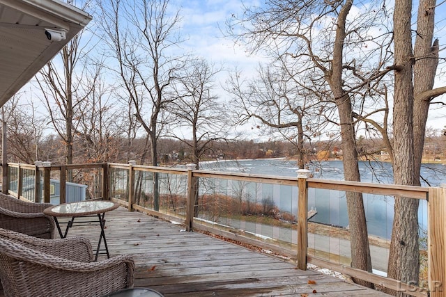 wooden terrace with a water view