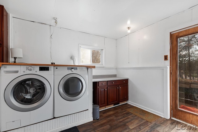 laundry area with dark hardwood / wood-style flooring and independent washer and dryer