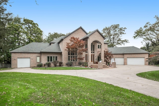 view of front of house with a front lawn and a garage
