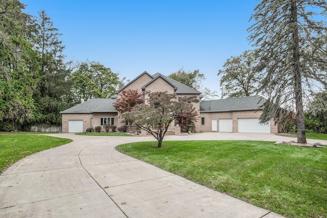 view of front of home featuring a garage and a front yard