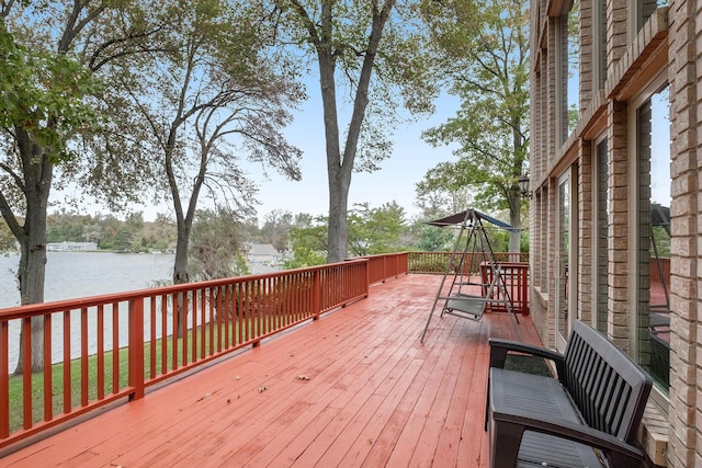 wooden terrace with a water view